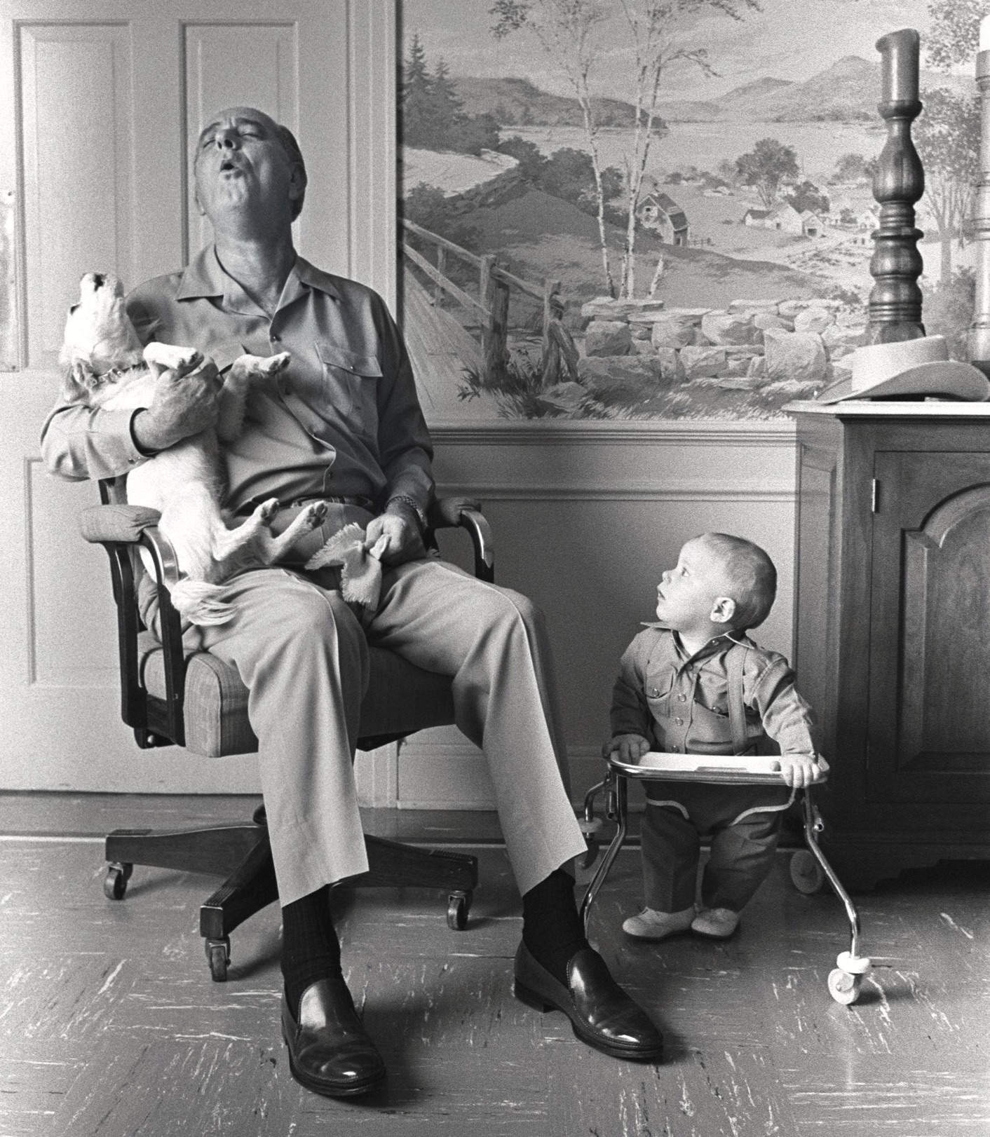 President Lyndon B. Johnson at his ranch with his dog Yuki and grandson Patrick Lyndon Nugent, 6 January 1968 